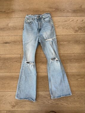 Light Wash Distressed 70’s Flare Jeans - Women's